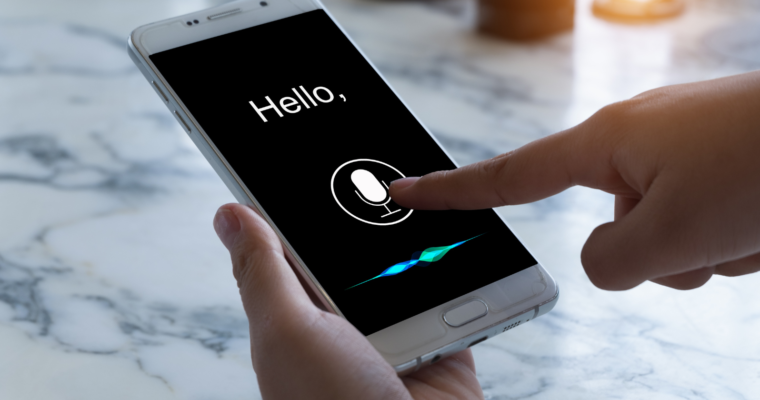 A phone screen displaying voice enabled mobile app feature with a 'Hello' text